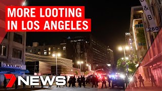 American riots Protesters leave but looting continues in Los Angeles  7NEWS [upl. by Yerffe]